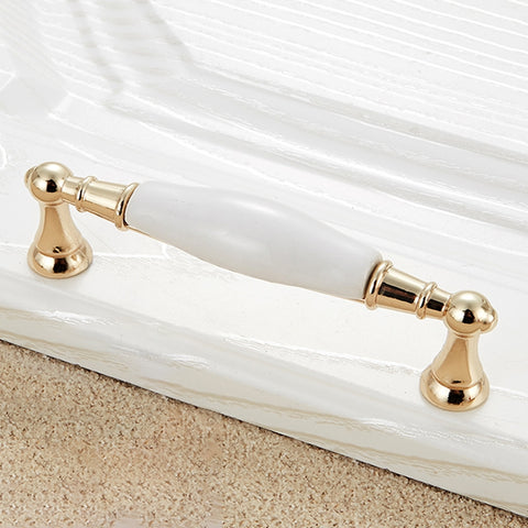 Maniglia in ceramica effetto oro per armadio - Distanza fori 128 mm,